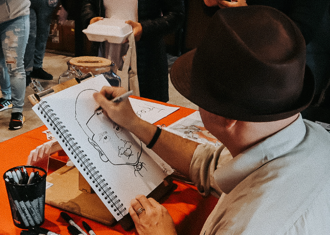 A caricature being created